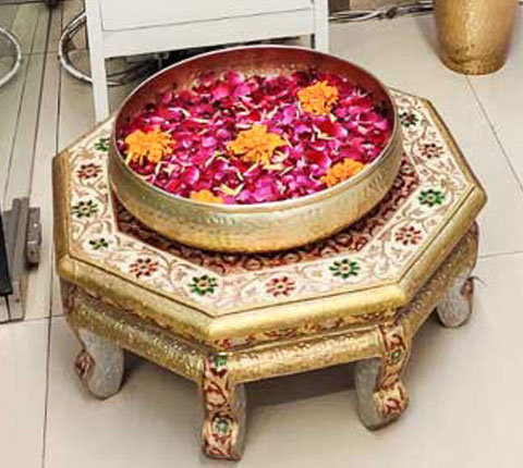 A silver coloured idol of deity placed in Radiance Aesthetic Clinic