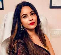 Dr. Poonam Arya sitting in her office chair