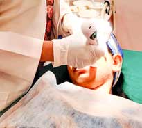 Dr. Poonam Arya providing acne treatment to a patient in her clinic
